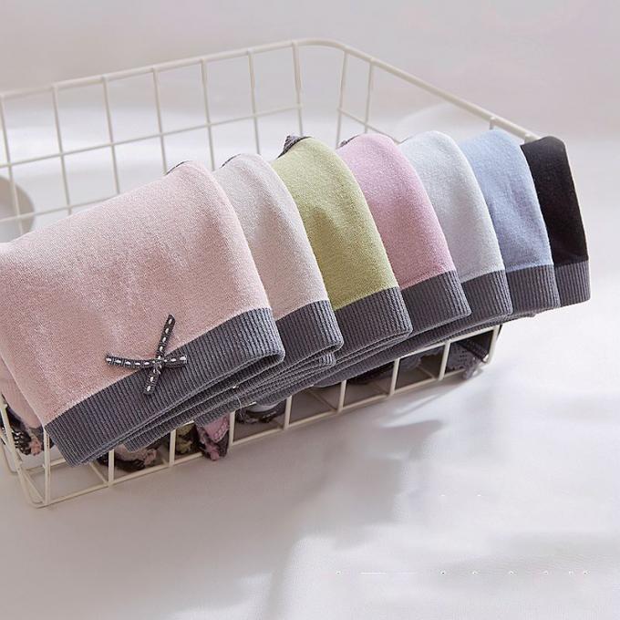 卸し売り下着のパンティーは女性の継ぎ目が無い中間のウエストの綿の下着の女性のためのビキニのパンティーをひもで締める
