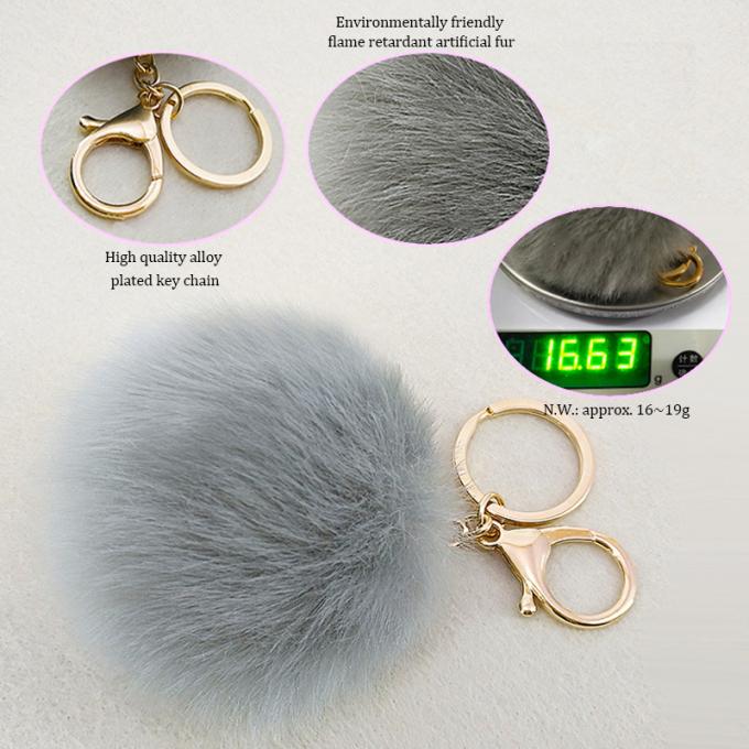 卸し売りかわいいのどのウサギの毛皮の球車のPom Pomのキー ホルダーのハンドバッグの吊り下げ式の財布の魅力のピンクKeychainは唐辛子スプレーKeychainを