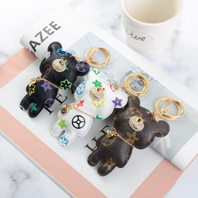 卸し売り革くま犬のKeychainの吊り下げ式袋は女性のための付属品のダイヤモンドくまKeychain Keychainsを飾る
