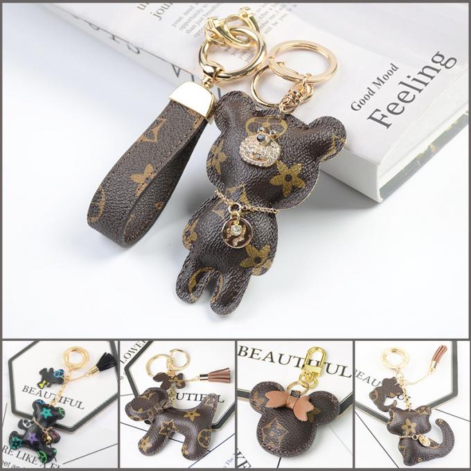 卸し売り革くま犬のKeychainの吊り下げ式袋は女性のための付属品のダイヤモンドくまKeychain Keychainsを飾る