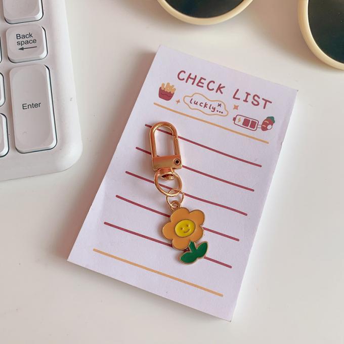 卸し売りウサギのKeychainの小さい花の金属の吊り下げ式袋は女性のための付属品のかわいい漫画Keychainsを飾る