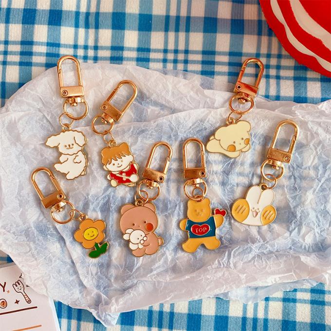 卸し売りウサギのKeychainの小さい花の金属の吊り下げ式袋は女性のための付属品のかわいい漫画Keychainsを飾る