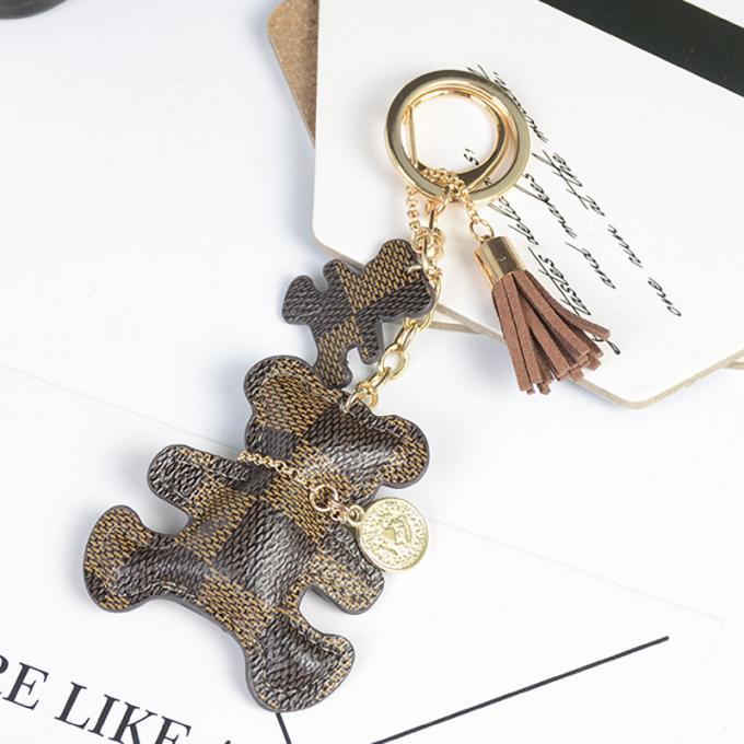 卸し売り革くま犬のKeychainの吊り下げ式袋は女性のための付属品のダイヤモンドくまKeychain Keychainsを飾る
