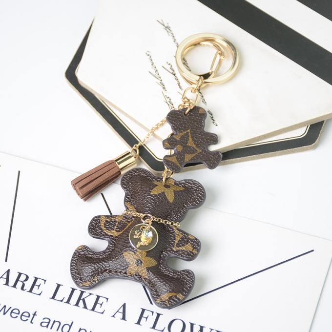卸し売り革くま犬のKeychainの吊り下げ式袋は女性のための付属品のダイヤモンドくまKeychain Keychainsを飾る